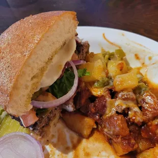 Half green chile burger and Christmas style home fries. We split it up before I remembered to take a picture so the plate is messy.