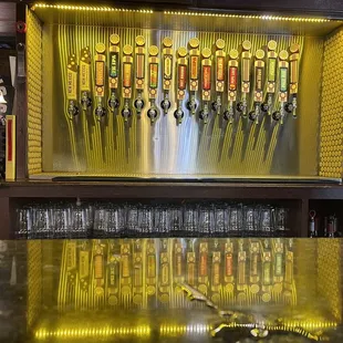 a row of beer taps