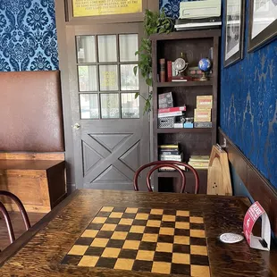 a checkerboard table and chairs