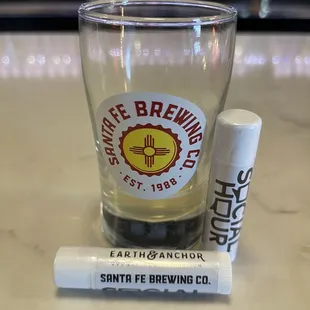 Beer chapstick and empty beer.