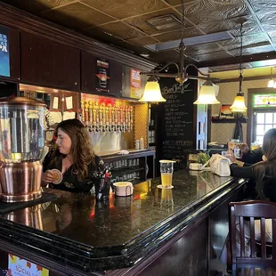 a woman sitting at the bar