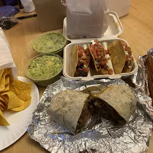 Barbacoa Burrito, Chicken Tacos, Churros, and guacamole and chips