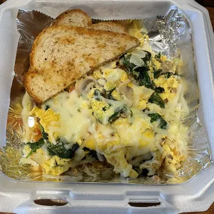 a breakfast in a styrofoam container