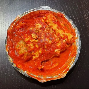 a dish of pasta and meat