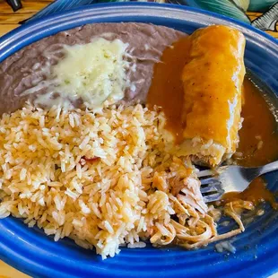 Lunch chicken enchilada with rice and refried beans. Yumm.