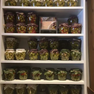 a shelf full of olives