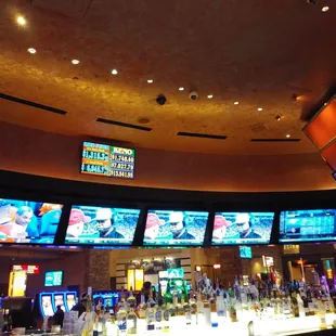 a bar with multiple televisions