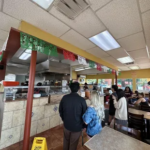a group of people in a restaurant