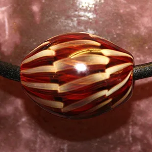 A fabulous flameworked glass bead by artist, Greg Hoff