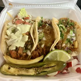 Fish taco on the left, Al pastor on the right