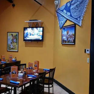 Family dining room art with tv