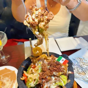 a woman eating a bowl of food
