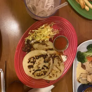 Bean/cheese pupusas with curtido and salsa de tomate (tomato suace)