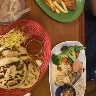 Chicken fingers and fries with horchata in left corner.
