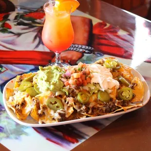 Nachos Supreme with a Tequila Sunrise