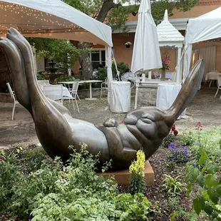 a large bronze sculpture of a man's foot