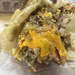 Pancho burrito. Assuming these are leftover fries from the night before with a little egg.