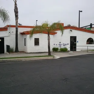 a white building with a red roof