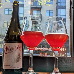 two wine glasses and a bottle