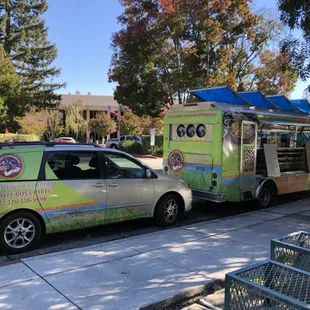 an ice cream truck parked on the side of the road