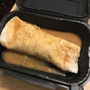a burrito in a styrofoam container