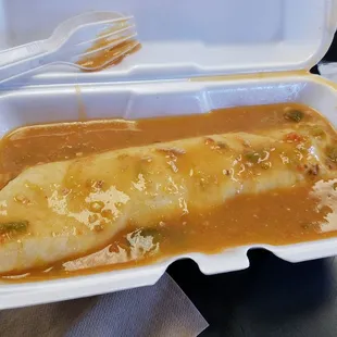 smothered chicken with rice burrito for $4.25.  should have gotten deluxe (cheese/lettuce/tomatoes) for $1.25 more