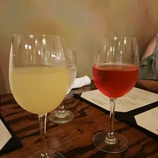 two glasses of wine on a table