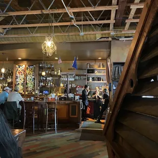 a woman sitting at a bar