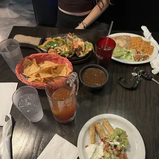 a table full of mexican food