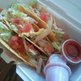 Three hard shell beef tacos.