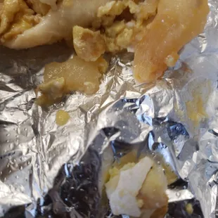 a piece of food wrapped in foil