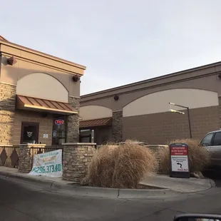 a car parked in front of the restaurant