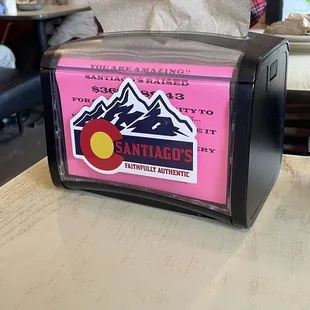 a pink box with a sticker on it
