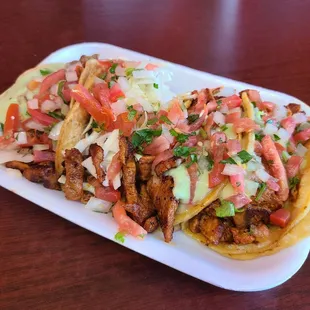 Starting left to right: Asado, Pescado (Fish), Al Pastor (x2)