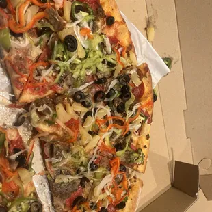 Supreme with added jalapeños and pineapple..