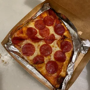 a pepperoni pizza in a box