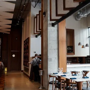 a restaurant with a long table and chairs