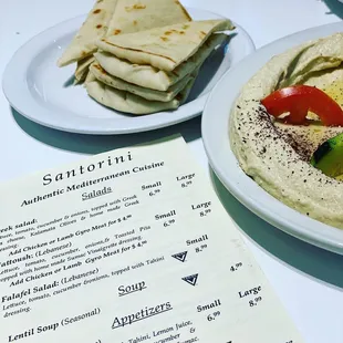 Menu, pita bread and hummus