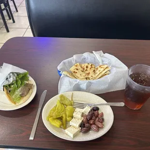 Peppers, cheese, and olive appetizer with fresh pita bread