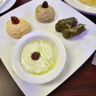 a plate of appetizers on a table