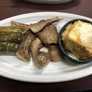a plate of meat and vegetables