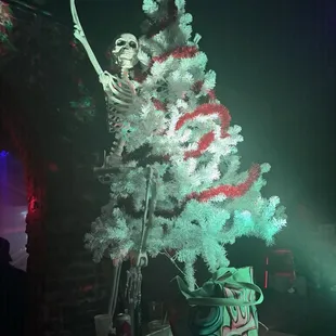Skeleton climbing a Christmas tree