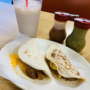 Horchata, carne guisada with cheese flour, bean and egg corn. Red and green salsa.