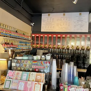 a coffee shop with a menu on the wall