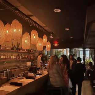 people standing at the bar