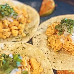 three tacos on a tray