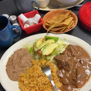 Carne guisada plate on bottom Caldo con pollo on top