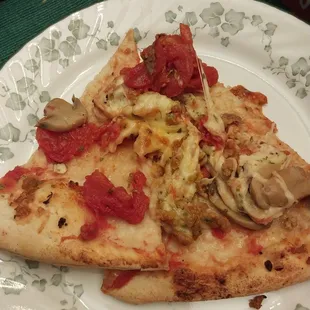 a slice of pizza on a plate