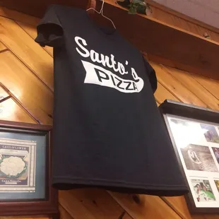 a t - shirt hanging on a wall