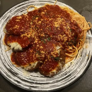 a plate of spaghetti and meat